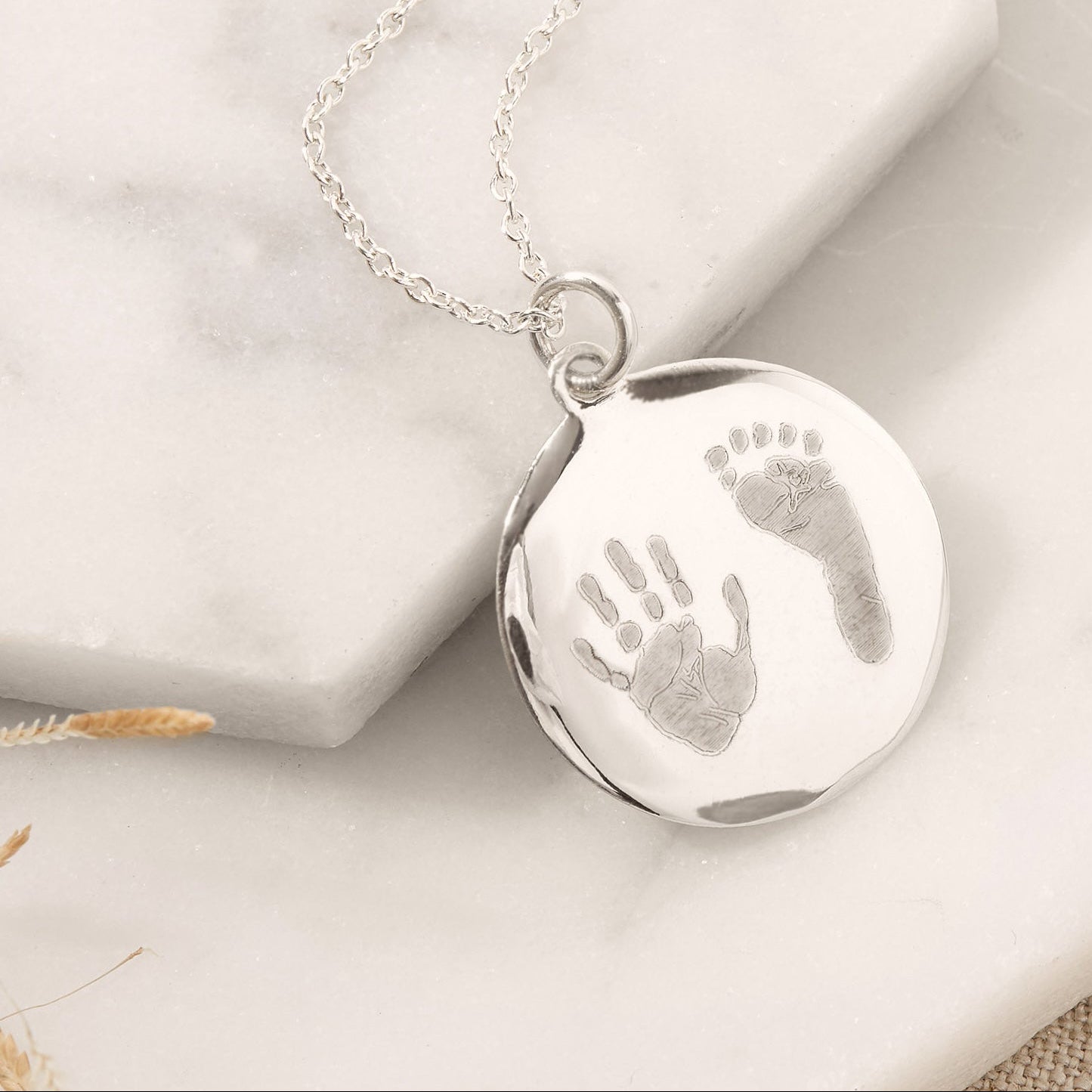 silver handprint and footprint necklace